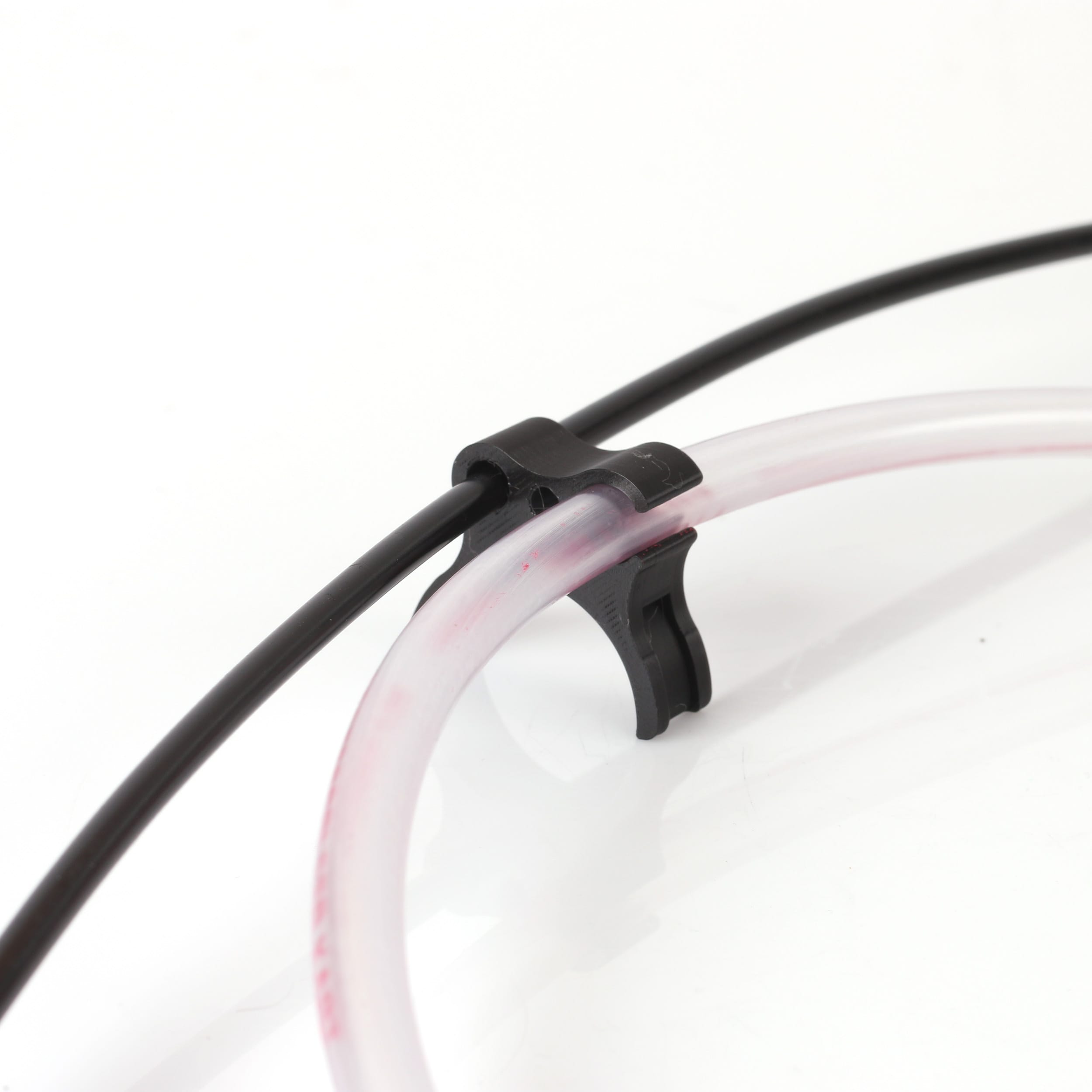 Holder for fuel hose and throttle cable blue