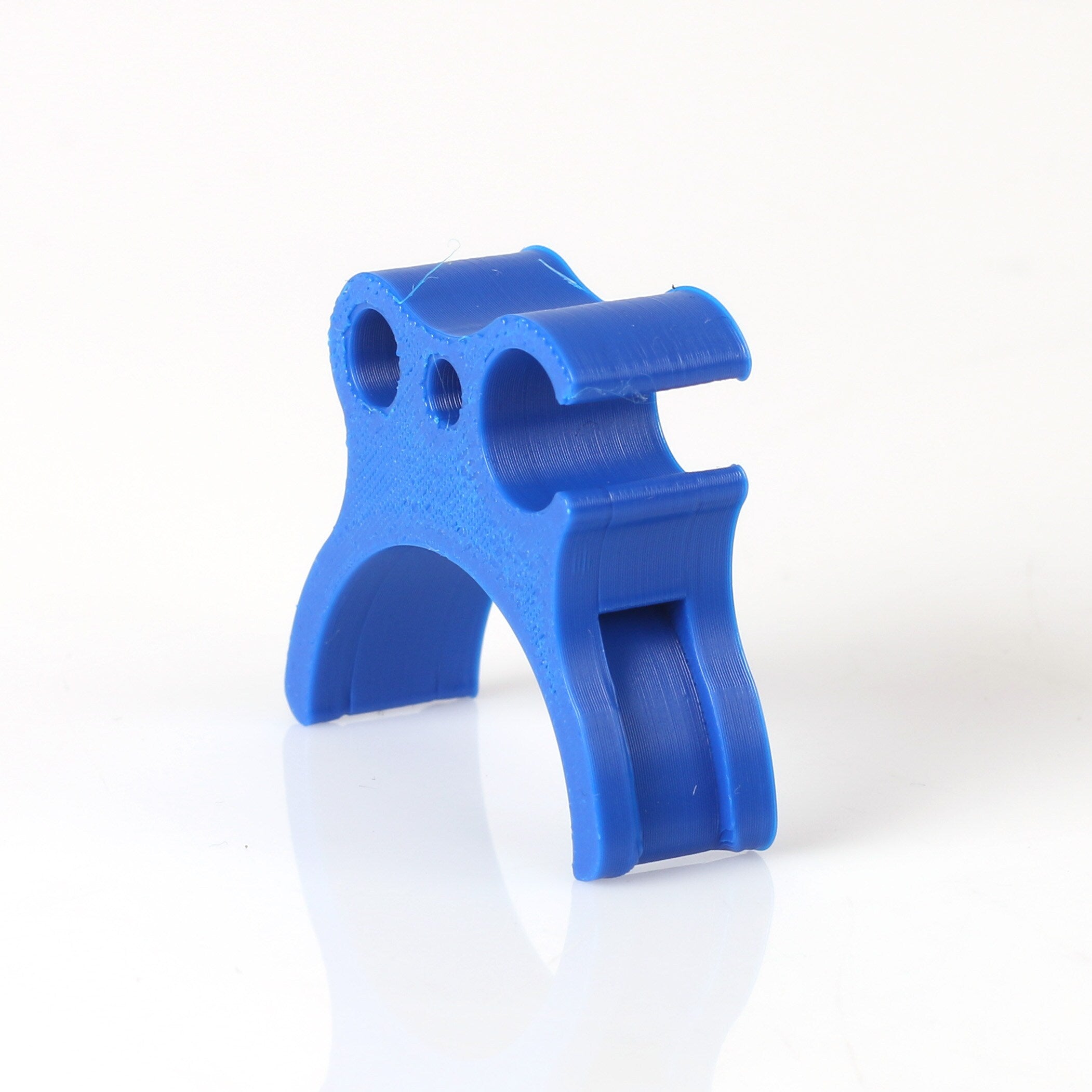 Holder for fuel hose and throttle cable blue